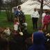 Arbor Day, child and Carolyn Finzer dressed as Morton Oak planting tree, Scott Mehaffey speaking on microphone to crowd