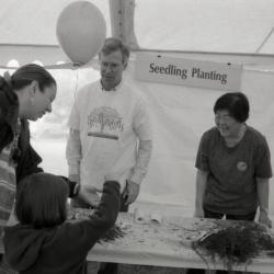 Arbor Day activities at The Morton Arboretum, woman and child at Seedling Planting station