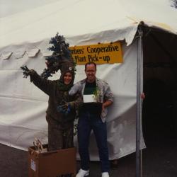 Arbor Day, Carolyn Finzer dressed as Morton Oak and Mike Spravka at the members' cooperative plant pickup tent