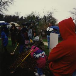 Arbor Day, group watching children and Carolyn Finzer dressed as Morton Oak plant tree