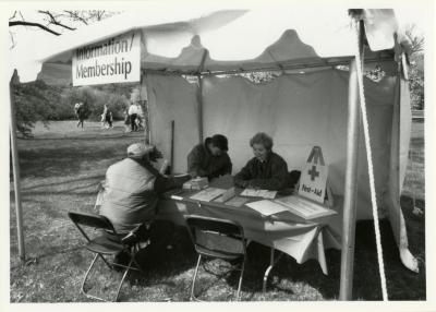 Arbor Day, Mike Cluff and Georgia Rutherford helping a visitor at the membership tent