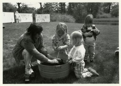 Arbor Day/Week, Marsha Davis planting with children