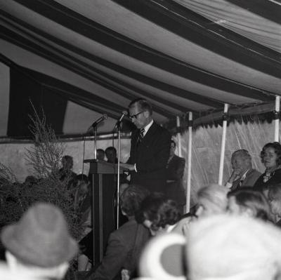 Arbor Day Centennial, tree planting afternoon program, James Olson at podium speaking to seated guests in tent on J. Sterling Morton, founder of Arbor Day