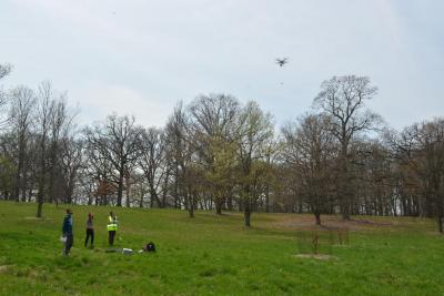 Lane Scher and undergraduate research fellows collecting pollen with a drone