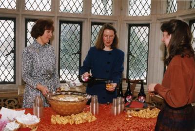 George Ware Retirement Party in Founders Room - Rita Hassert pouring plum wine with Susan Klatt (left)