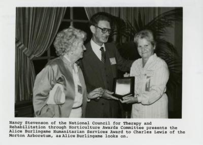 Nancy Stevenson presents Alice Burlingame Humanitarian Services Award to Charles Lewis