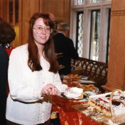 George Ware Retirement Party in Founders Room - Rose Rieger serving cake