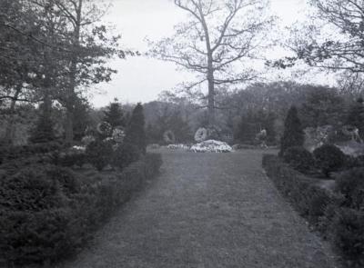 Mowed path leading to Joy Morton burial plot with flowers