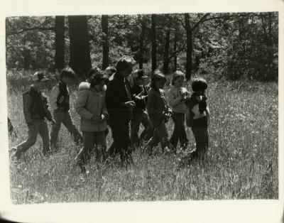 Morton Arboretum Guide, Alice Burkman, with school group of children in the woods