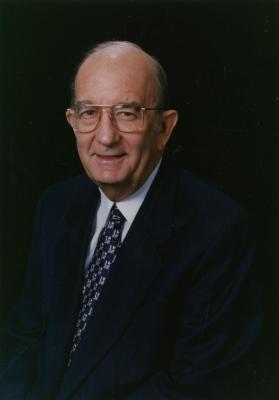Jerry C. Bradshaw, seated portrait, black background