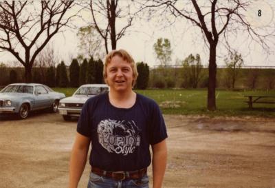 Curtis Berland standing in gravel parking lot