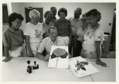 Herbarium's 75,000 accession, volunteers with Nina Podrasky (left), Bill Hess (seated), Web Crowley (standing third from R)