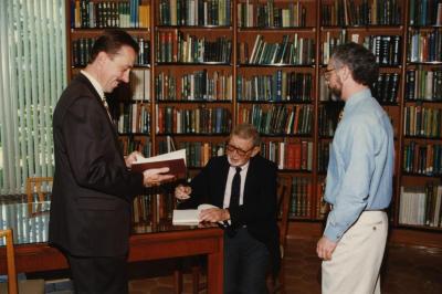 Green Nature, Human Nature book signing in Sterling Morton Library, Charles Lewis signing, Gerry Donnelly and Christopher Dunn standing