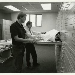 Rick Hootman and Joe Larkin reviewing maps and plans in the new Map Room