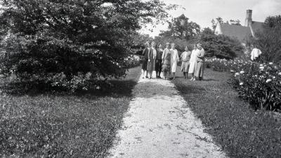 Margaret Gray Morton and friends along path at residence