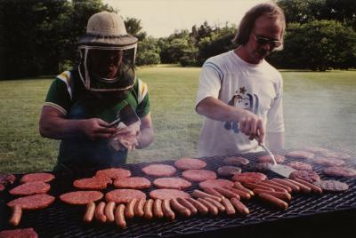 Ross Clark (L) and Chad Avery (R) grilling meat on Thornhill lawn at Employee picnic