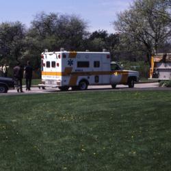 Ambulance and fire truck parked by Visitor Center at Arborfest