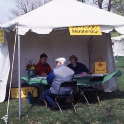 Visitor at Information/Membership tent during Arbor Week