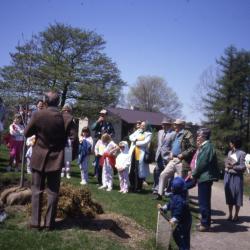 George Ware speaking at Arbor Day tree planting  (facing crowd) with Visitor Center in background