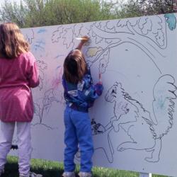 Two young girls coloring on Coloring Mural during Arbor Week