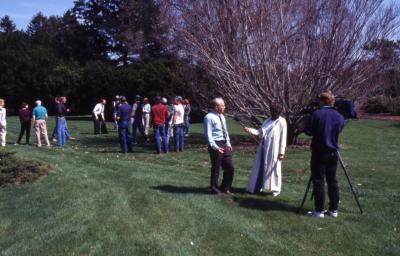 George Ware getting interviewed on Arbor Day with employees in background
