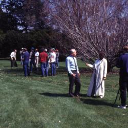 George Ware getting interviewed on Arbor Day with employees in background