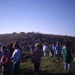 Crowd walking toward and on berm on Earth Day