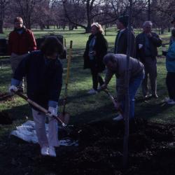 Linda Kovach and Joe Larkin with shovels at Arbor Day employee tree planting