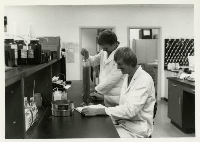 Pat Kelsey (left) and Rick Hootman soil testing in the lab