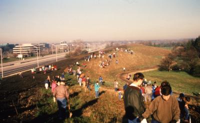 Overlooking crowd on berm along I-88 for Earth Day celebration and berm planting
