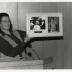 Jane Balaban, eyes closed, showing photos at Swink-Wilhelm book signing at Thornhill
