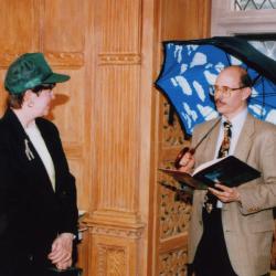 George Ware Retirement Party in Founders Room - Nancy Stieber in green cap; Michael Stieber with Magritte umbrella