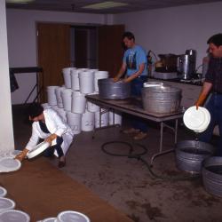 Salt Study, Rick Hootman and Pat Kelsey washing buckets, Rose Reid drying lids in research lab