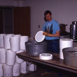 Salt Study, Rick Hootman washing buckets in research lab