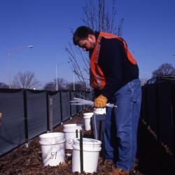 Salt Study, Pat Kelsey installing buckets in median on Lake Shore Drive