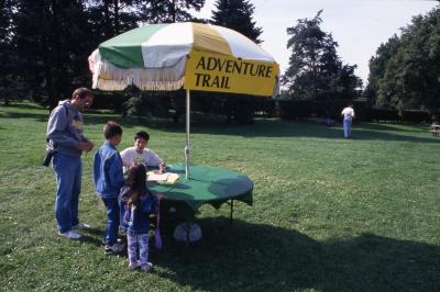 Family Fair Adventure Trail information table with visitors