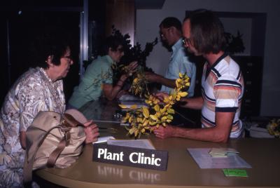 Chad Avery and Ed Hedborn helping visitors at Plant Clinic counter