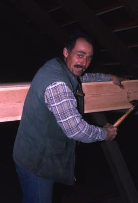 Bill Bergmann with hammer and board