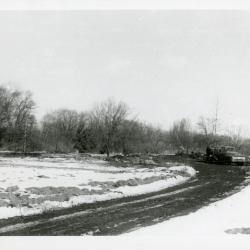 Reconstruction of Arboretum entrance drive in winter when Route 53 was widened showing road curve to left