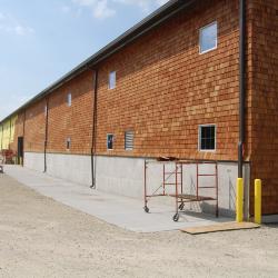 Shingle Siding being added on the new Vehicle Storage Building
