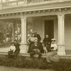 Morton family seated on porch outside of Arbor Lodge