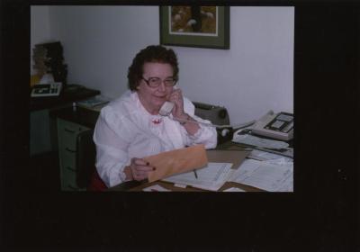 Myrtle Hansen on phone at desk