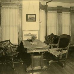 Arbor Lodge album: interior of house, room with table and chairs