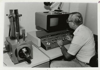 Dr. William Hess using the scanning electron microscope