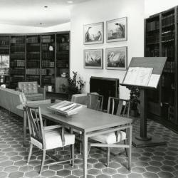 Sterling Morton Library, reading room, displays on tables and easel before fireplace
