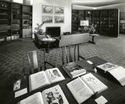 Sterling Morton Library, reading room, fireplace reading area, study table with display of books in foreground