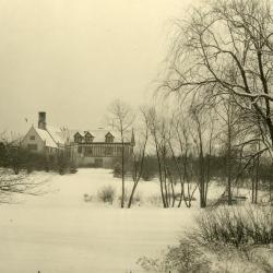 Looking east over small pond to Morton Residence at Thornhill in winter
