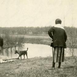 Clarence and Margaret Godshalk with their dog, Punch, at the river dam behind their house