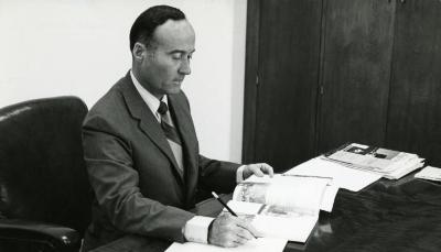 Marion T. Hall working at his desk