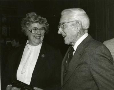 Clarence E. Godshalk's 90th birthday celebration scrapbook: Barbara Tyznik talking with Clarence Godshalk